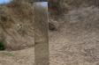 S Facing - Monolith blending in with sand