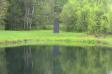 Pond Black Monolith Center Across Pond Monolith 2