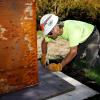 Devin Laurence Field installs his sculpture "Sentinels" outside Bush Barn Art Center in Bush's Pasture Park in Salem, Oregon, on Thursday, Aug. 22, 2019. CONNOR RADNOVICH / STATESMAN JOURNAL